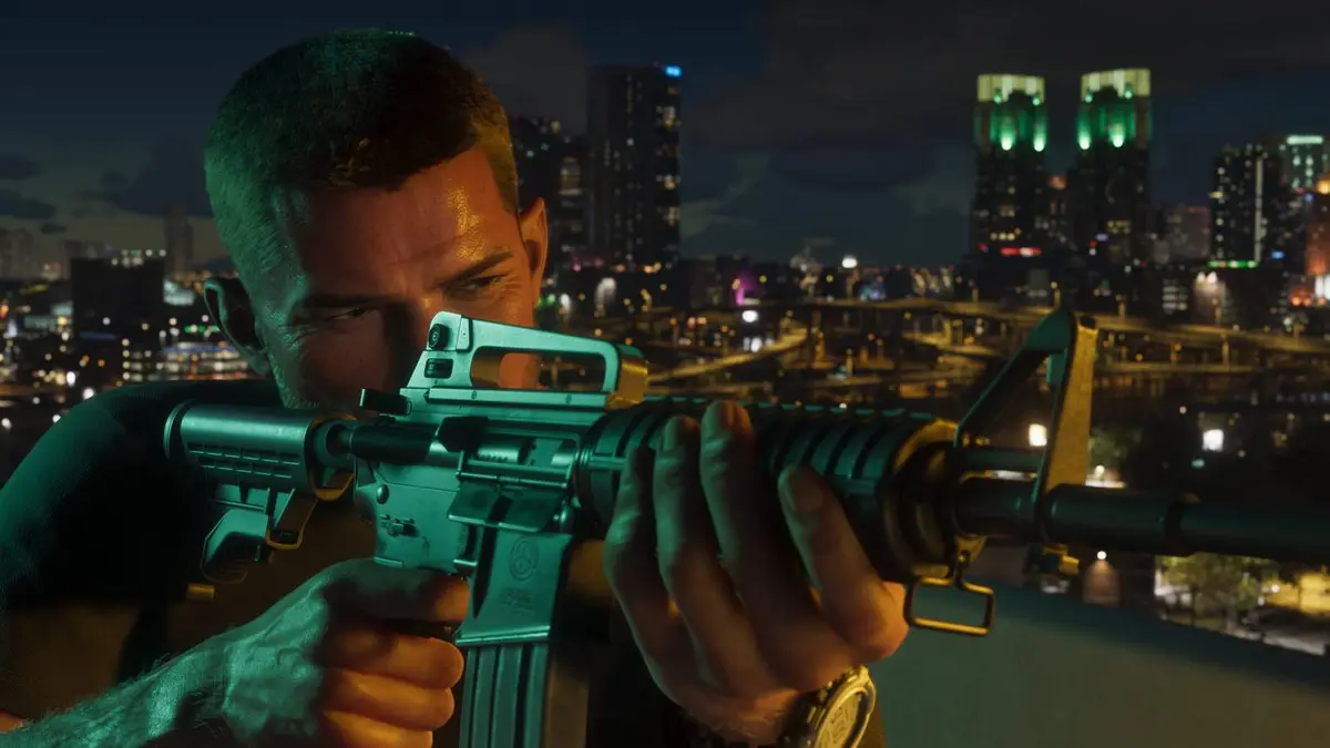 Grand Theft Auto 6 screenshot of Jason Duval pointing an M16 past the camera with Vice City in the background.