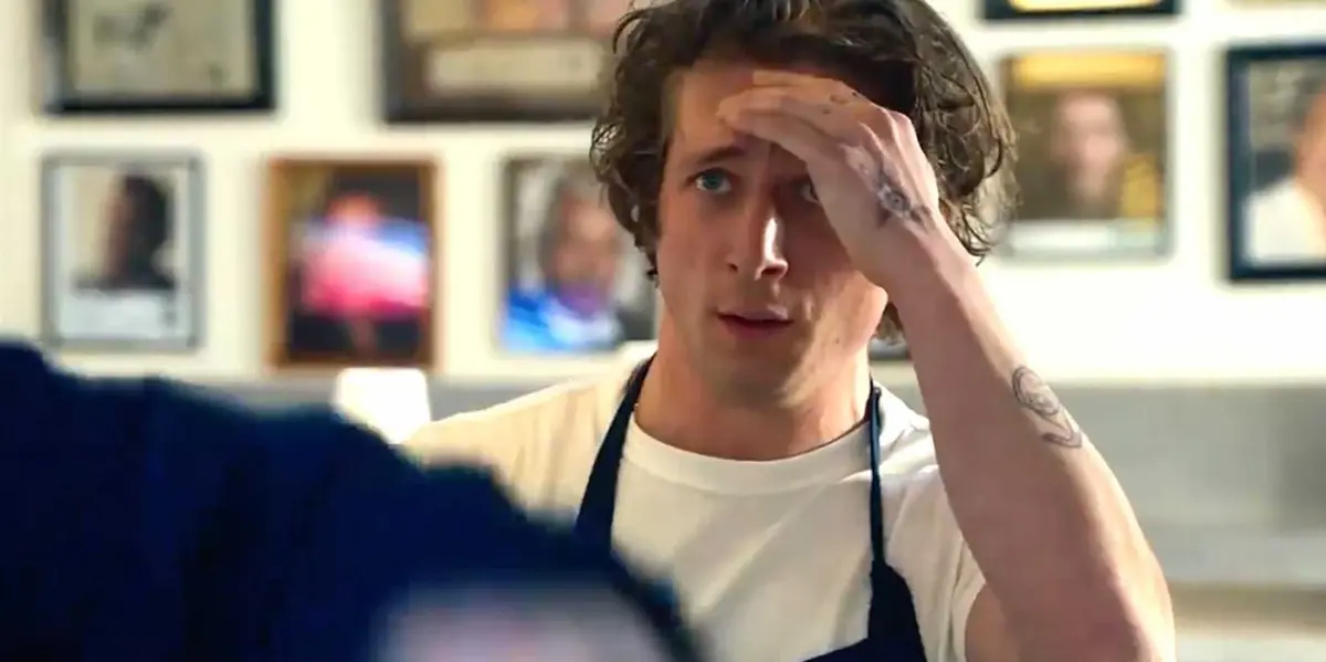 Carmy putting his hand to his head in The Bear