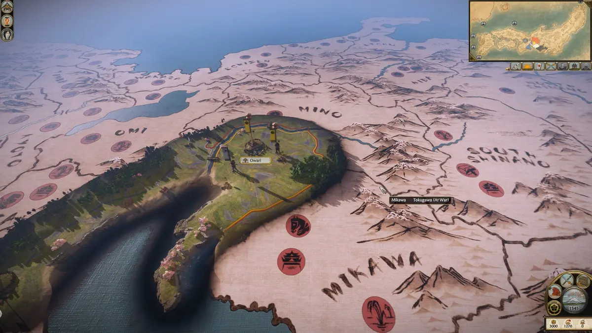 A 3D rendered map of feudal Japan displays a strategic overview, highlighting provinces and a central fortress with two banners, indicating a settlement named "Owari." The map features mountainous ter