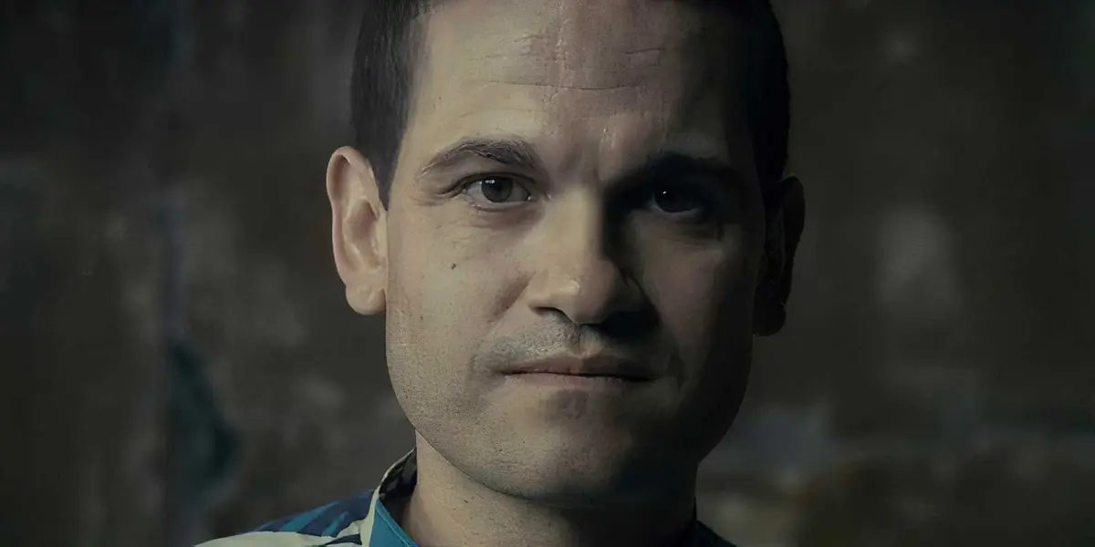A man looks into the camera.