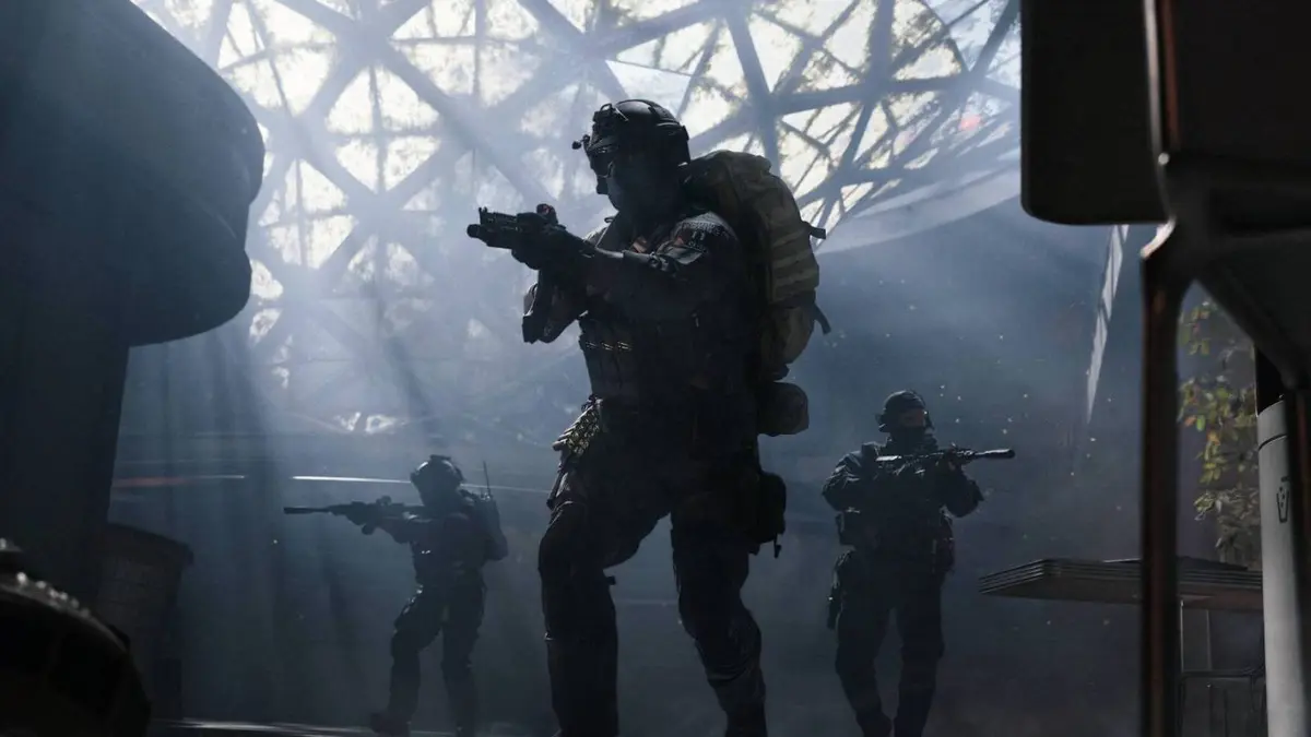 Three soldiers walking through a dark environment in DMZ.