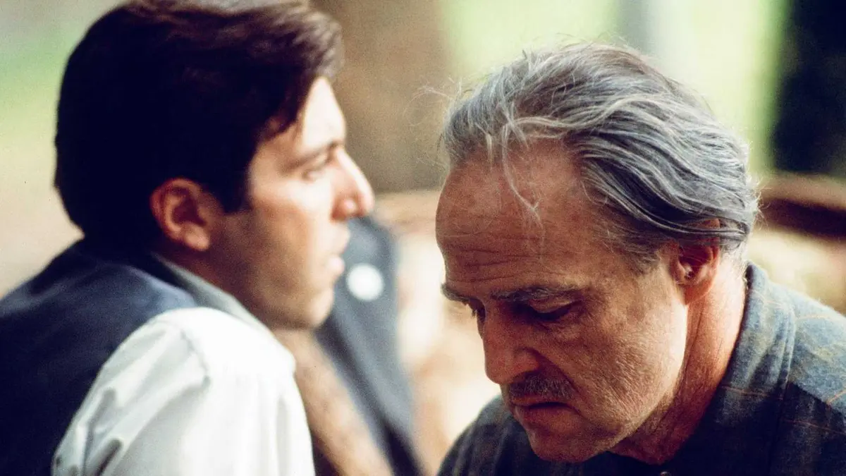 Al Pacino and Marlon Brando as Michael Corleone and Vito Corleone in The Godfather