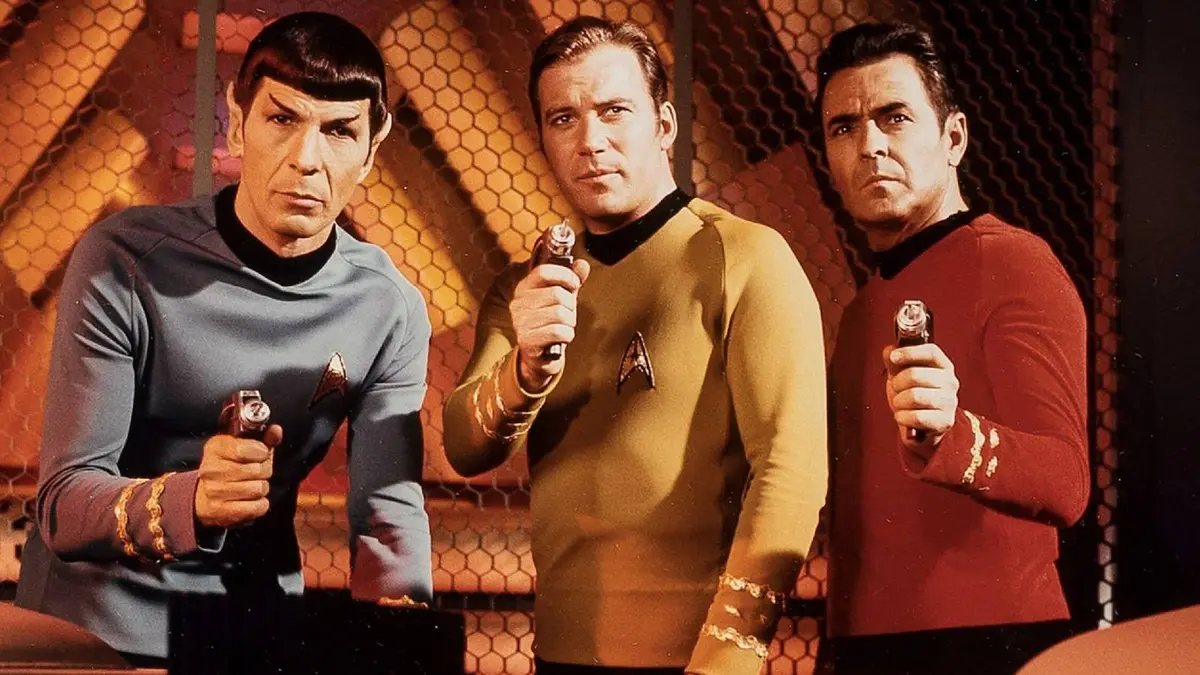 Star Trek's Spock Kirk and Scotty pointing phasers at the camera