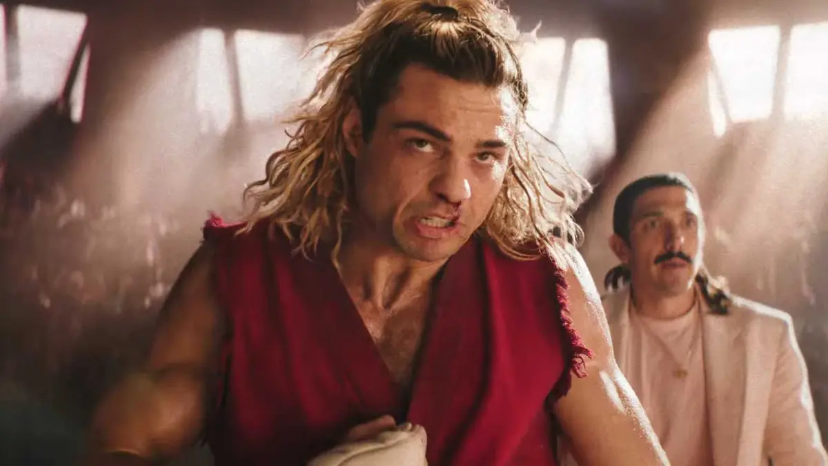 Noah Centeneo is finishing off a fight in Street Fighter