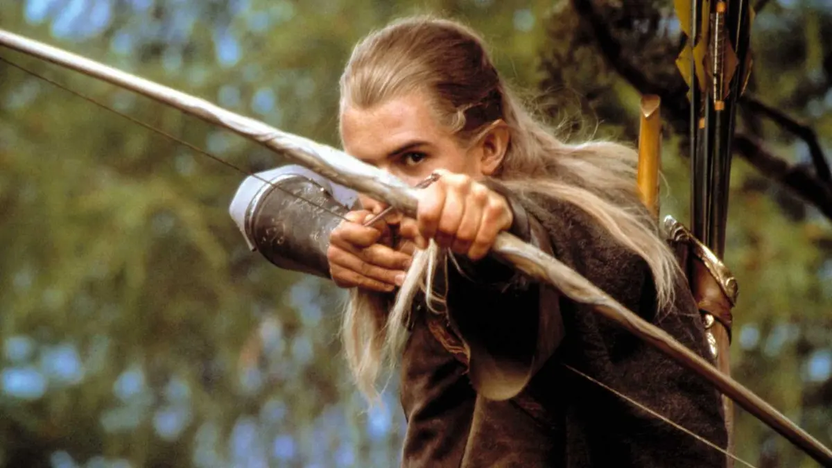 Legolas (Orlando Bloom) drawing back his bow and firing in The Lord of the Rings: The Fellowship of the Ring.