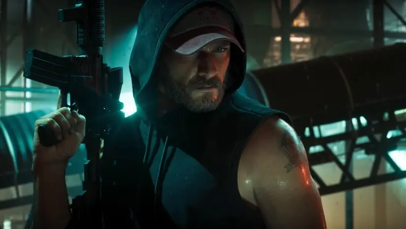 Jason from GTA 6 wears a black sleeveless hoodie while holding up a large assault rifle.