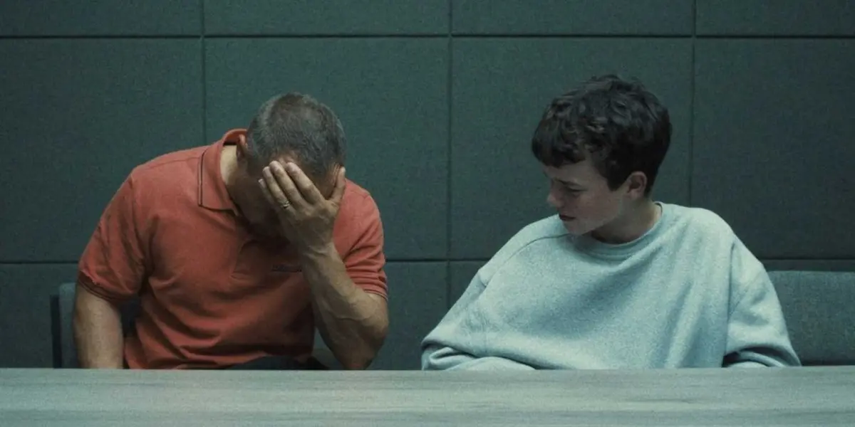 Jamie and Eddie sit in the interrogation room in Adolescence episode 1