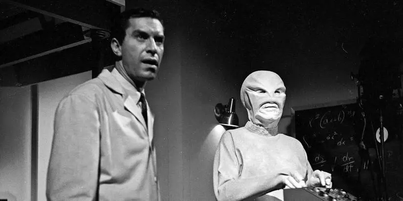 A man standing with an alien in The Outer Limits