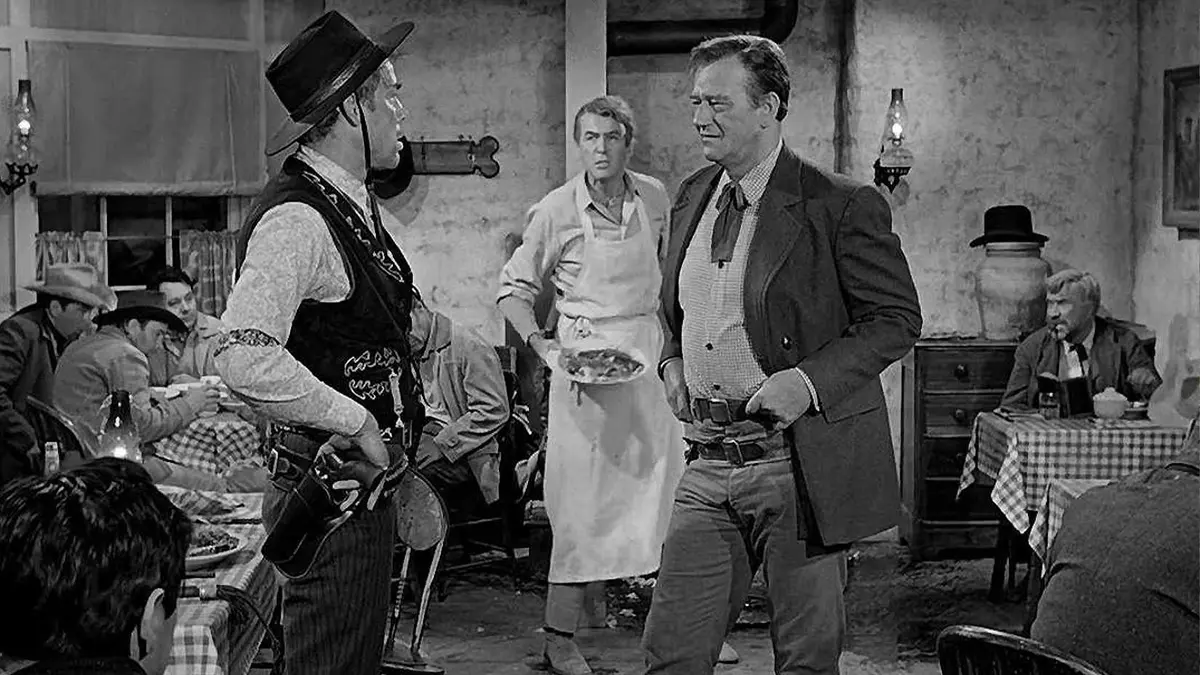 James Stewart and John Wayne are in a saloon in The Man Who Shot Liberty Valance.