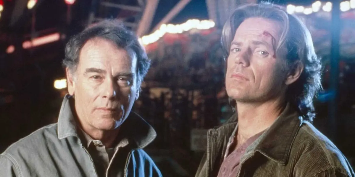 Two characters from Nowhere Man stare at the camera