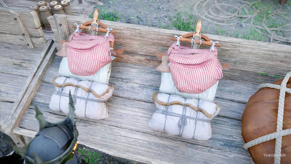 Kliff looking at two Peddler's Packs in Crimson Desert.