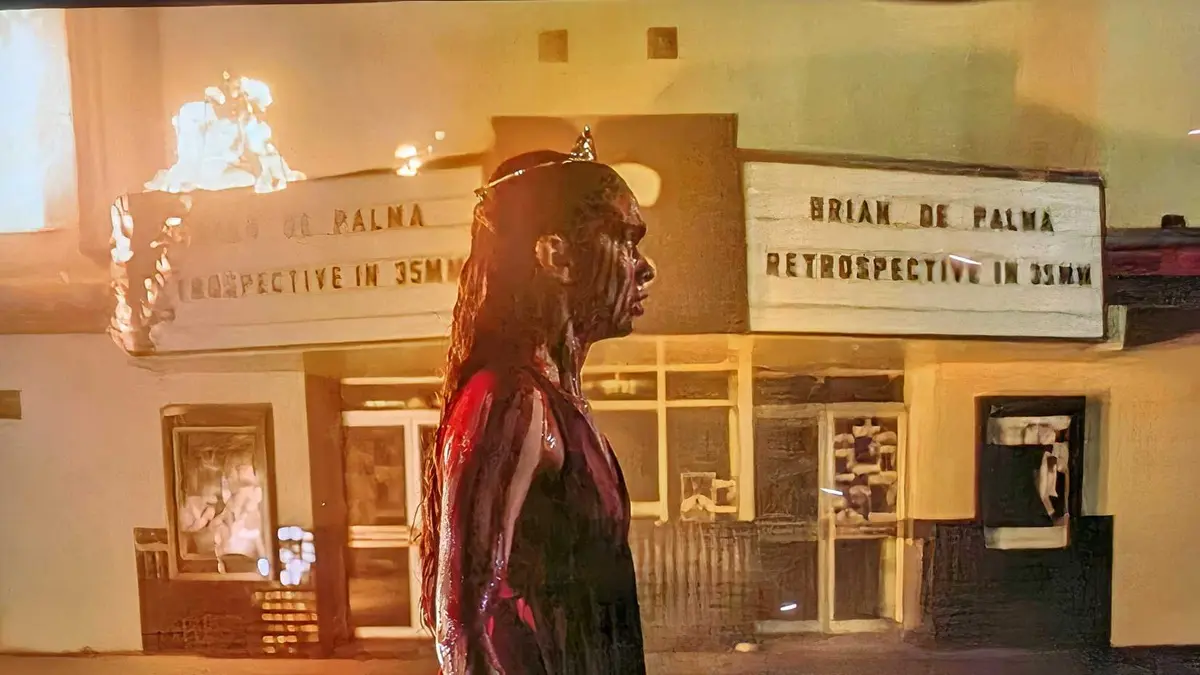 Summer H Howell as Carrie White covered in blood wearing her prom dress in Carrie