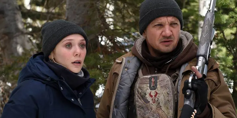 Jane and Cory look at the snowy horizon in Wind River.