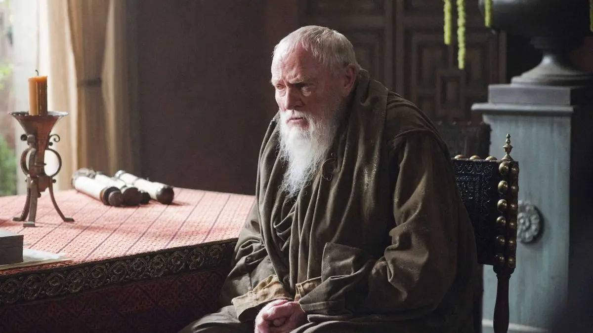 Julian Glover as Grand Maester Pycelle in Game of Thrones sitting