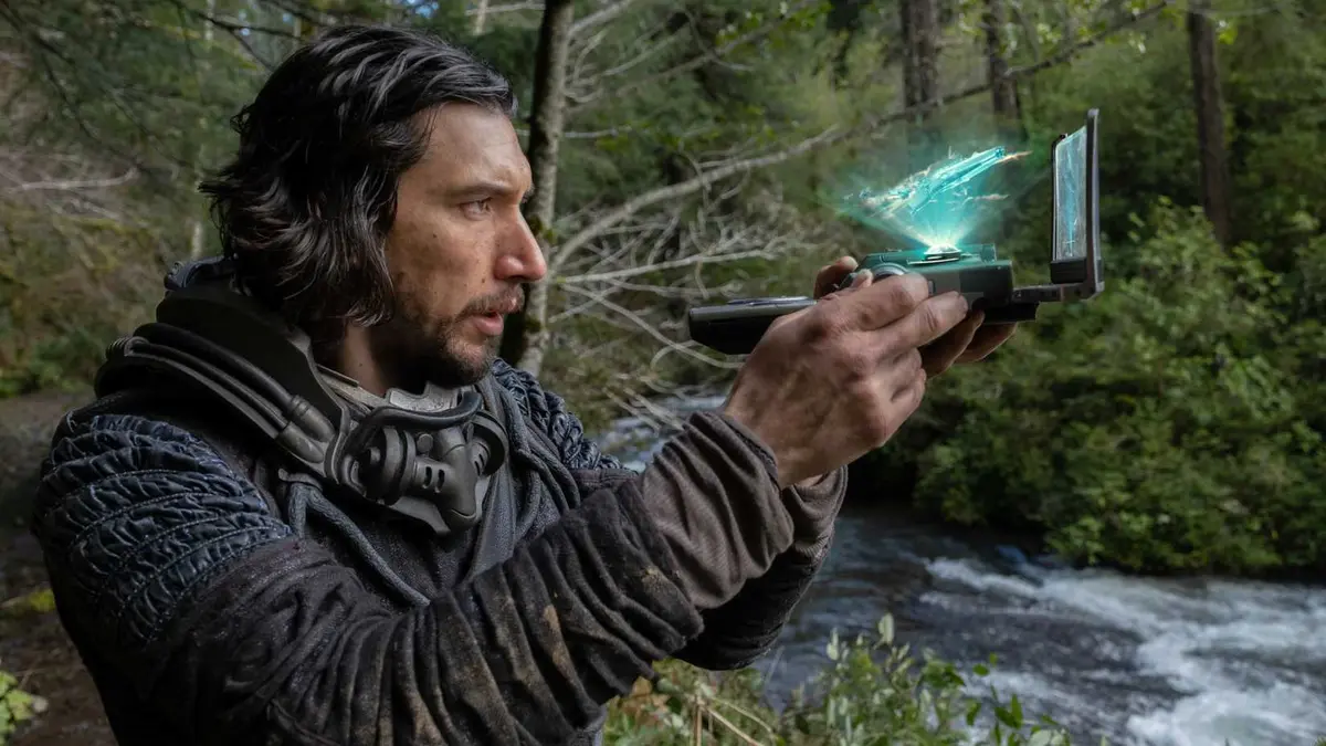 Adam Driver looking at a hologram in 65