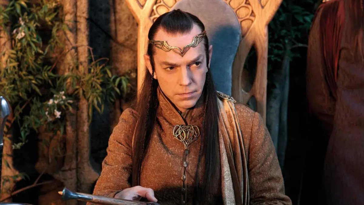 Hugo Weaving sitting on his chair as Elrond in The Lord of the Rings
