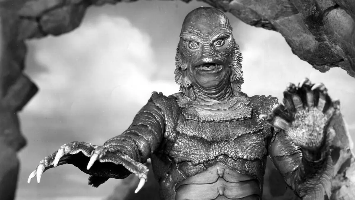 Gill-man reaches toward the camera in Creature from the Black Lagoon header