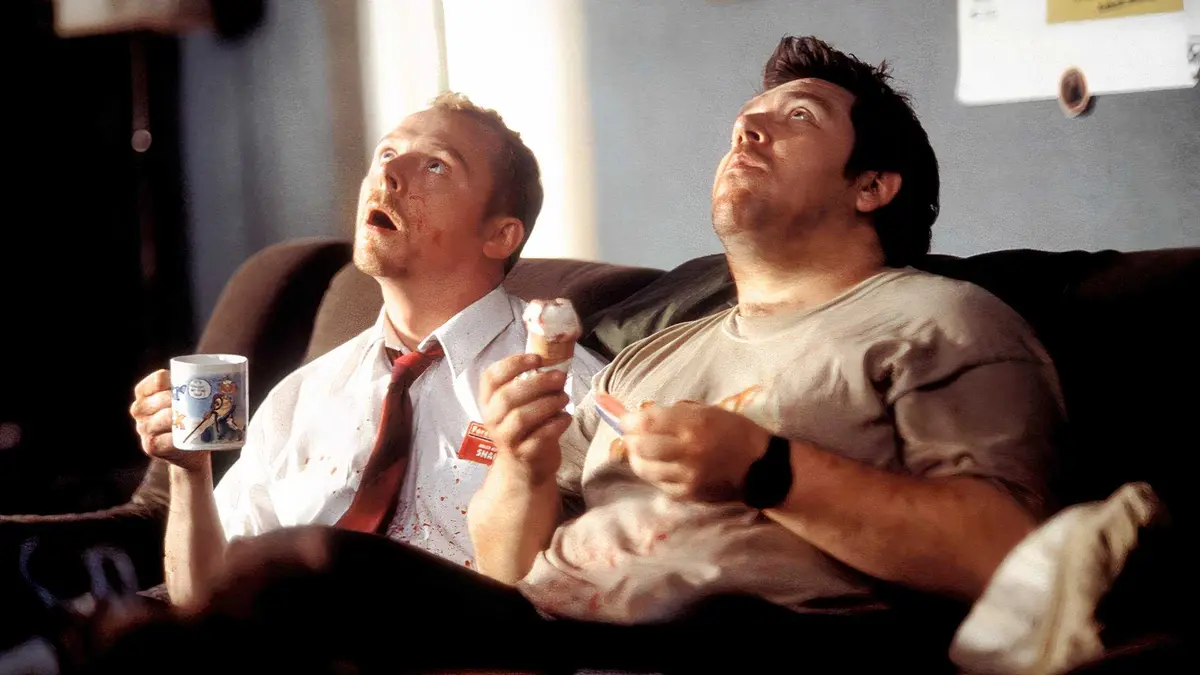 Shaun and Ed on the couch after killing a zombie in Shaun of the Dead