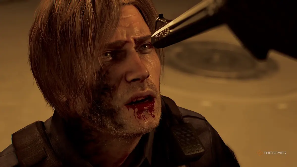 Leon has a gun held to his head in Resident Evil Requiem.