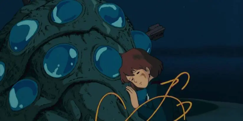 The baby Ohmu is trying to help Nausicaa in Nausicaa of the Valley of the Wind.