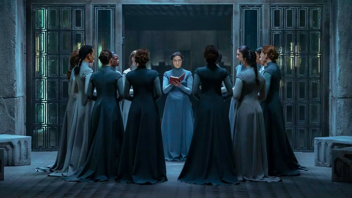 Bene Gesserit students study standing together