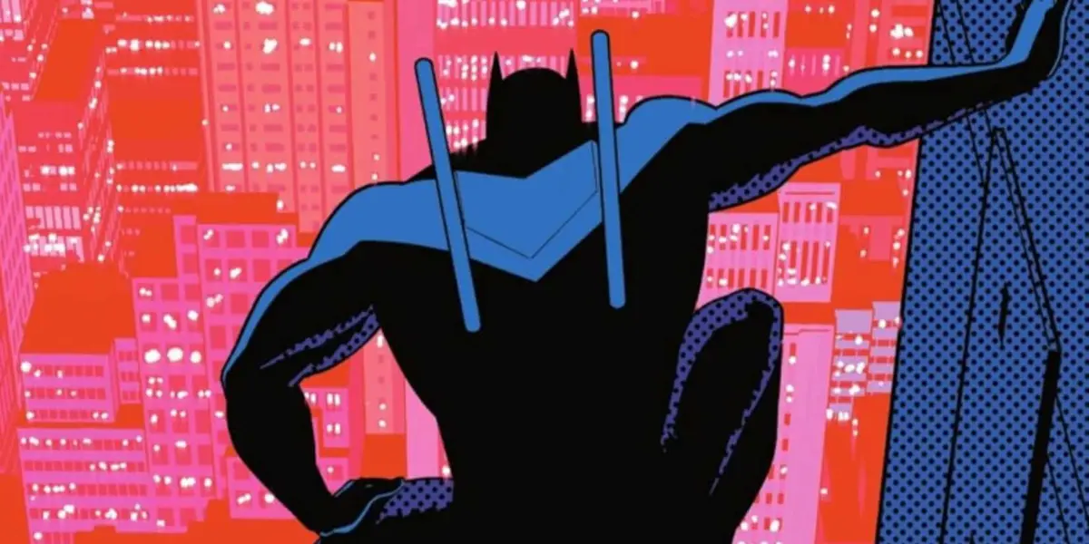 Batman wearing Nightwing's costume and looking over the city on the Nightwing #117 cover