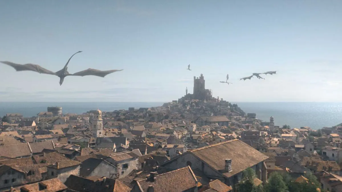 Dragons flying over King's Landing in House of the Dragon.