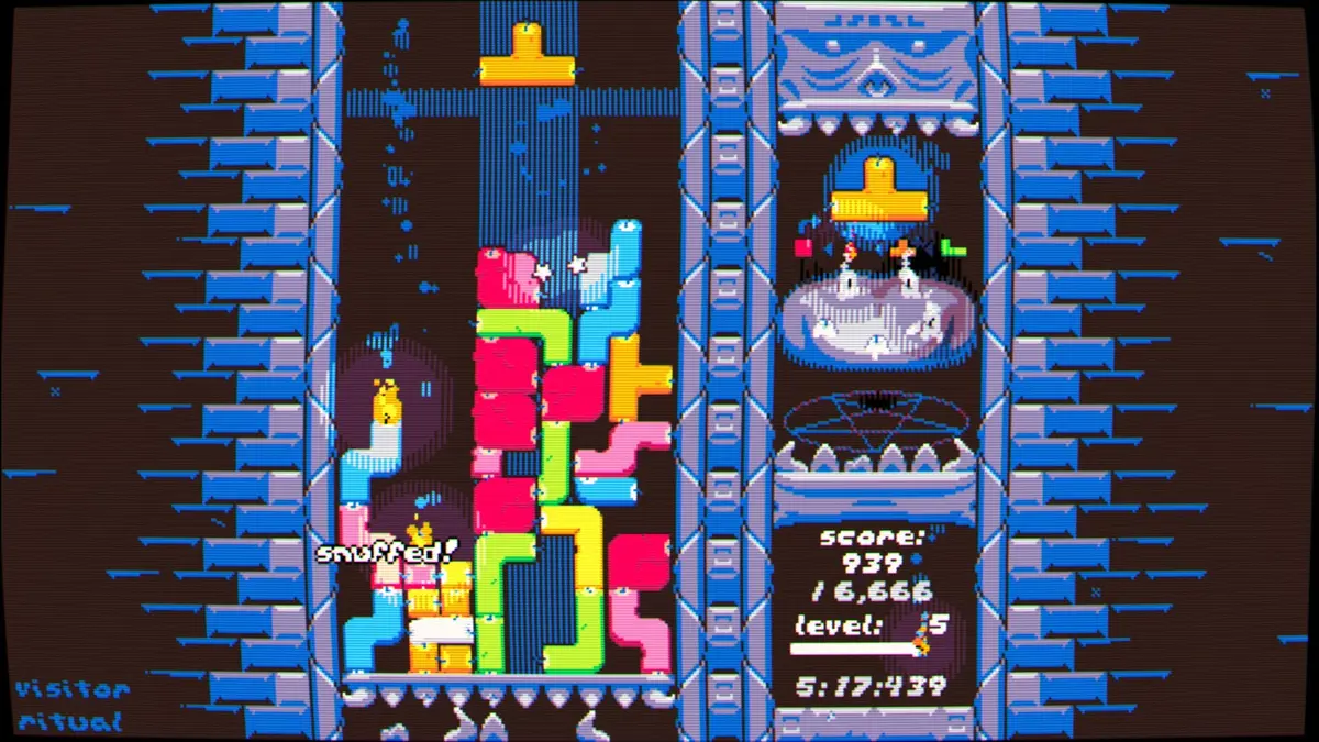 A game of arcade puzzler Hot Wax, showing coloured candle blocks falling from the top that must be kindled with carefully placed flames.