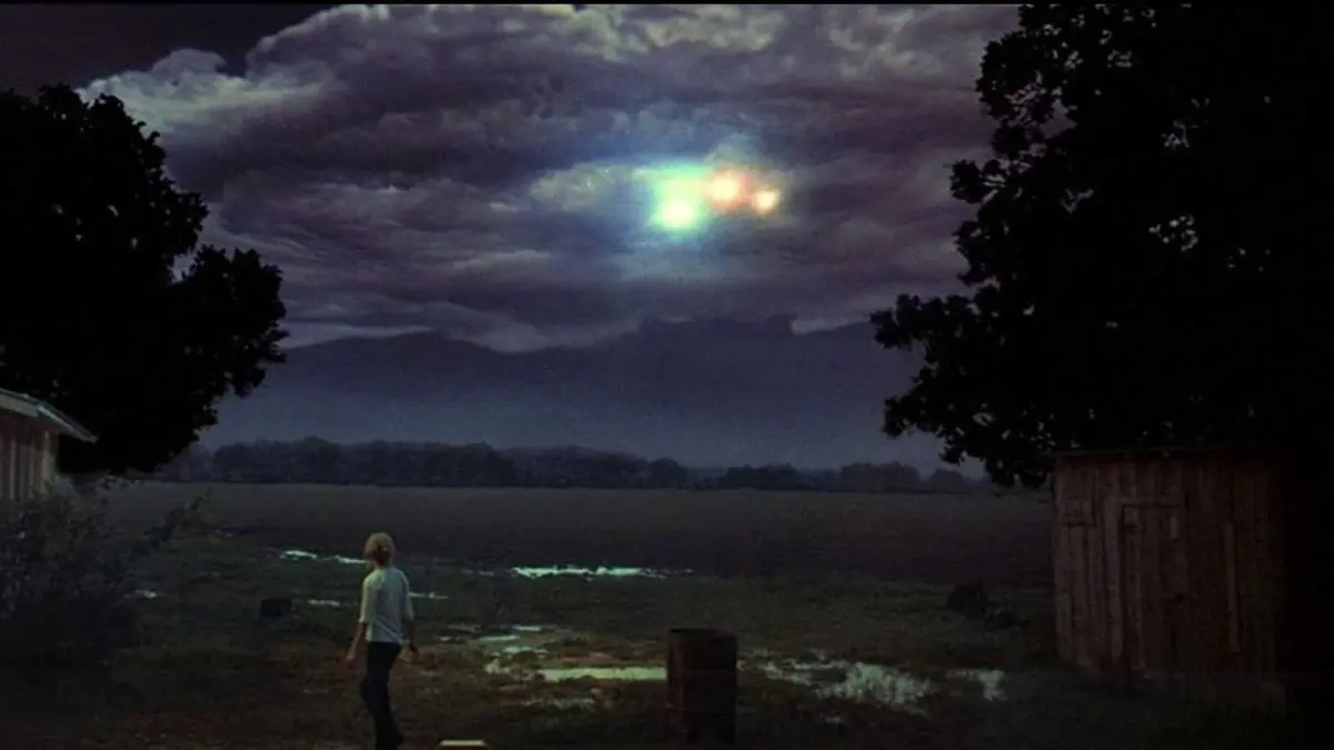 Bright lights appear through the clouds in Close Encounter of the Third Kind