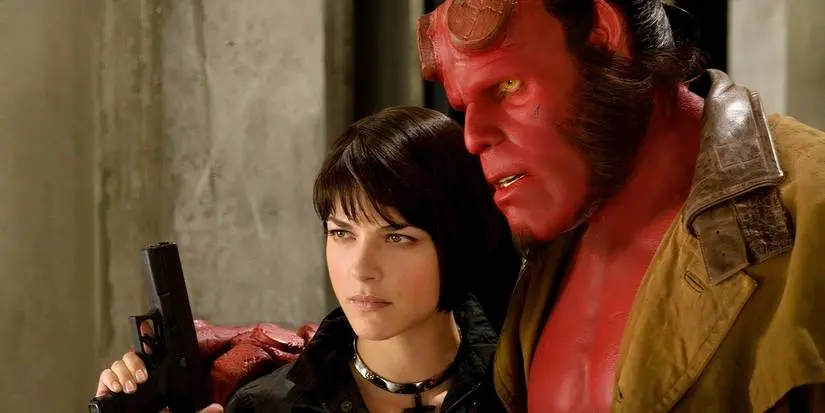 Hellboy, played by Ron Perlman, with his arm around Liz in the movie Hellboy 2: The Golden Army