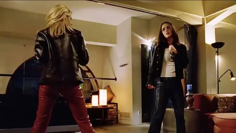 Buffy and Faith square off in Faith's apartment in Buffy the Vampire Slayer