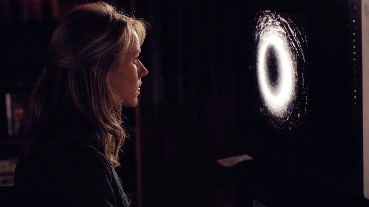Naomi Watts staring at a television in The Ring.