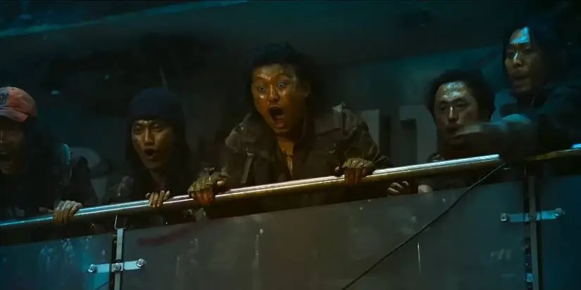 A group of survivors looking on in Train to Busan Presents_ Peninsula