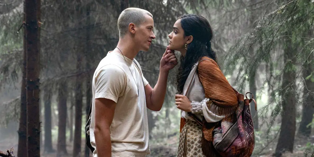Coriolanus Snow and Lucy Gray Baird in the woods in The Hunger Games: The Ballad of Songbirds and Snakes.