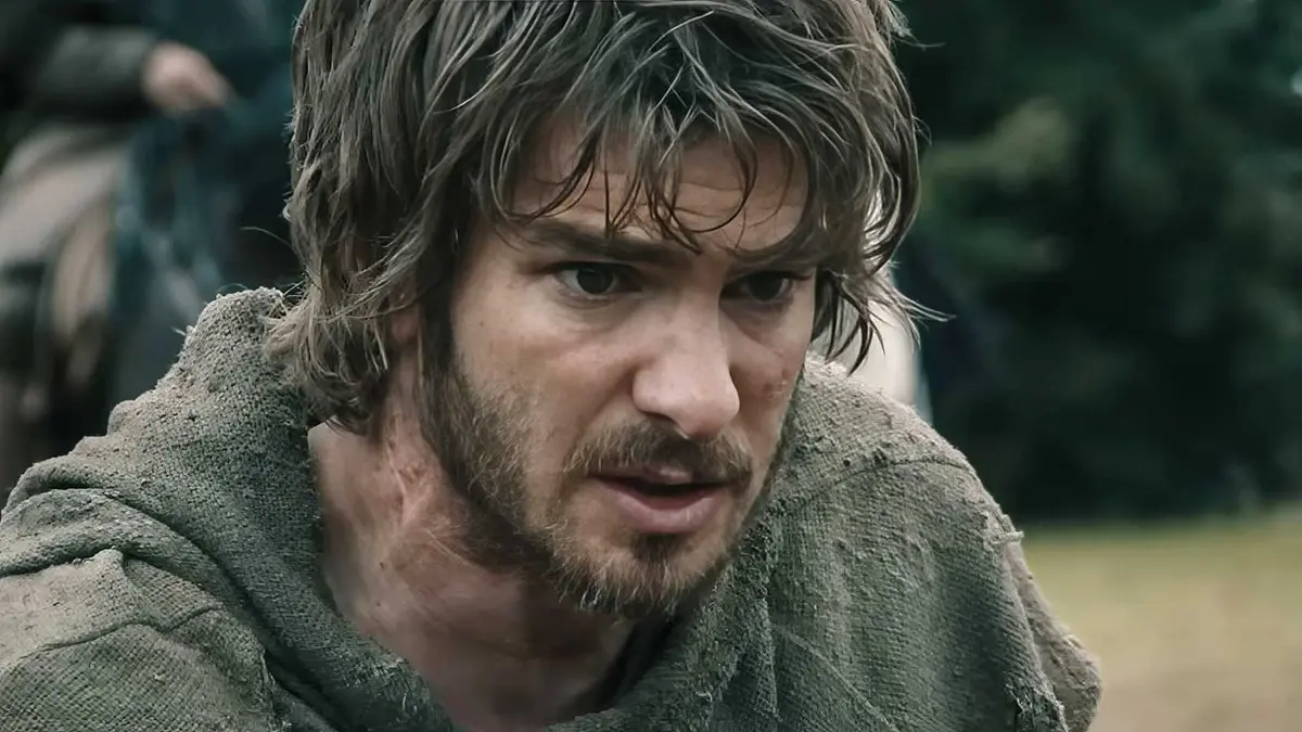 A close-up of Andrew Garfield looking shell-shocked in The Uprising