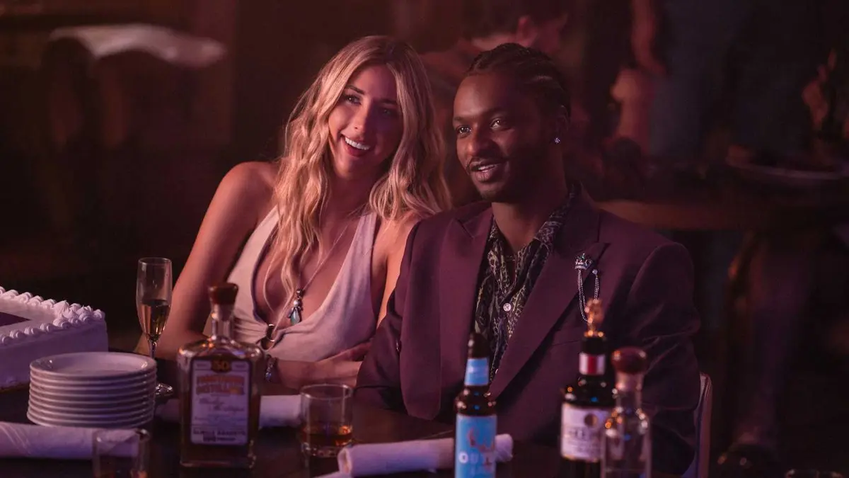 Scarlet Rose Stallone as Spencer and Jay Will as Tyson at a bar in Tulsa King season 3