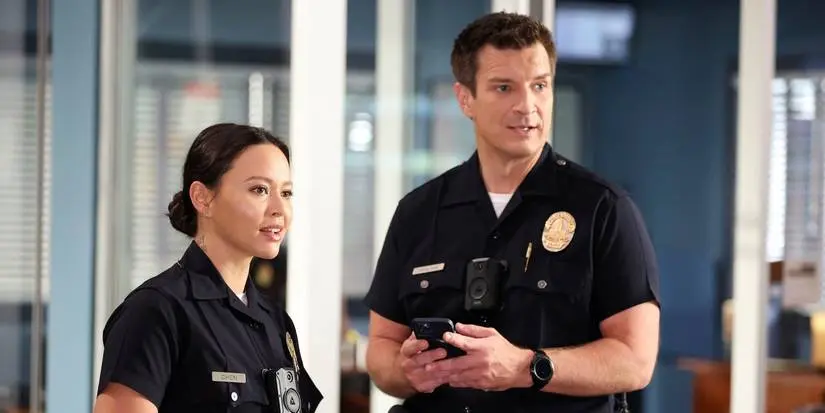 Lucy and John standing together on The Rookie