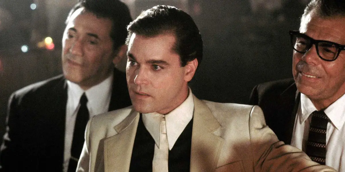 Ray Liotta as Henry Hill with Frank Adonis and John Manca in Goodfellas looking off-screen